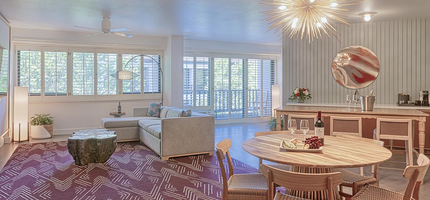 Hospitality suite living room and dining space.