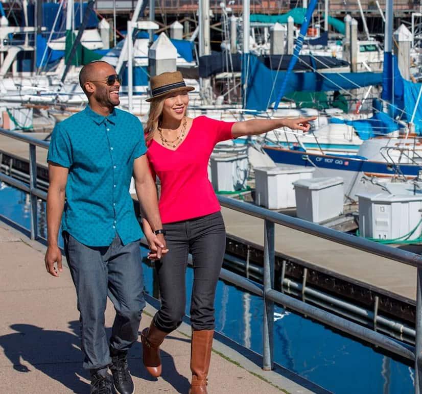 Couple looking at boats in the harbor