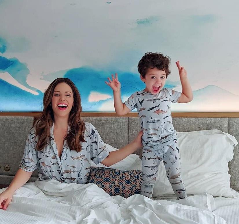 Family in bed at hotel